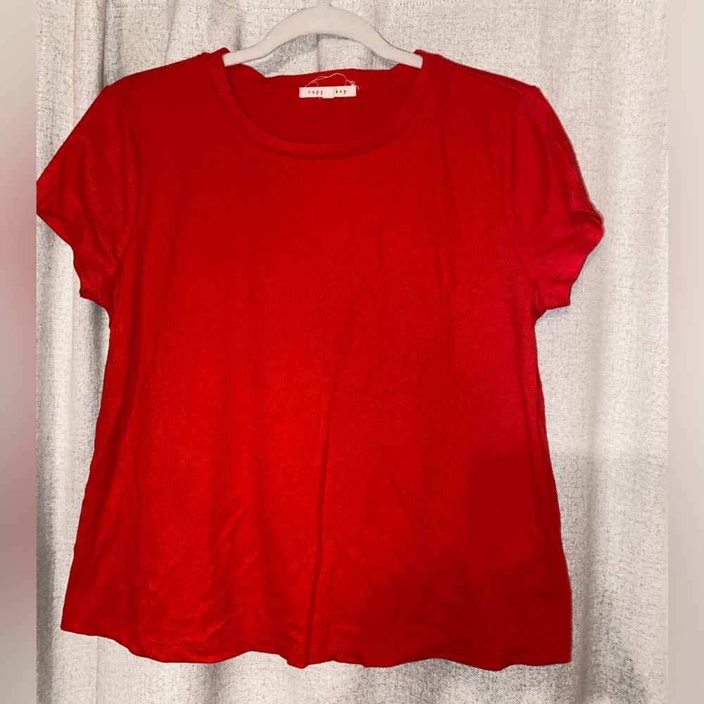 Selling a copper key red shirt